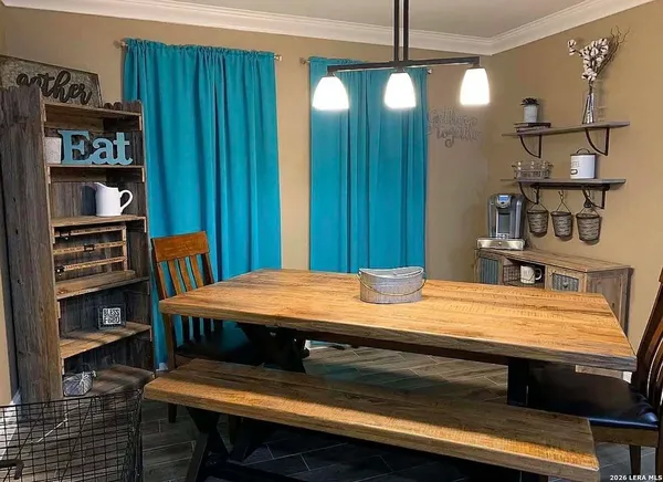 a room with a bed and a bookshelf