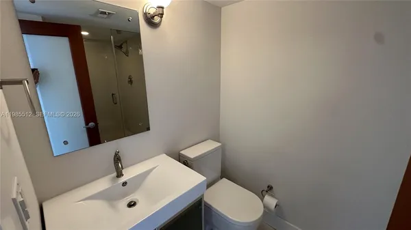 a bathroom with a sink and a toilet