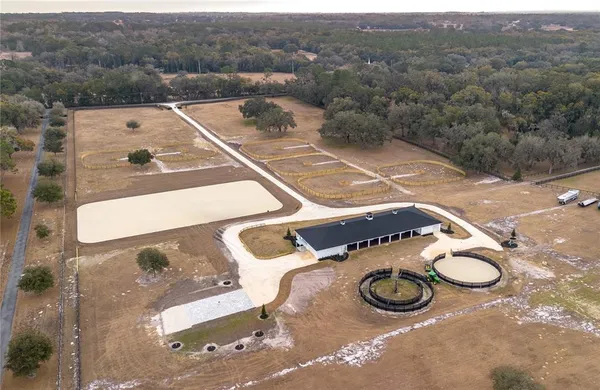an aerial view of a house with yard