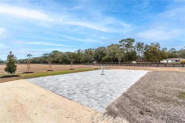 a view of a swimming pool and an outdoor space
