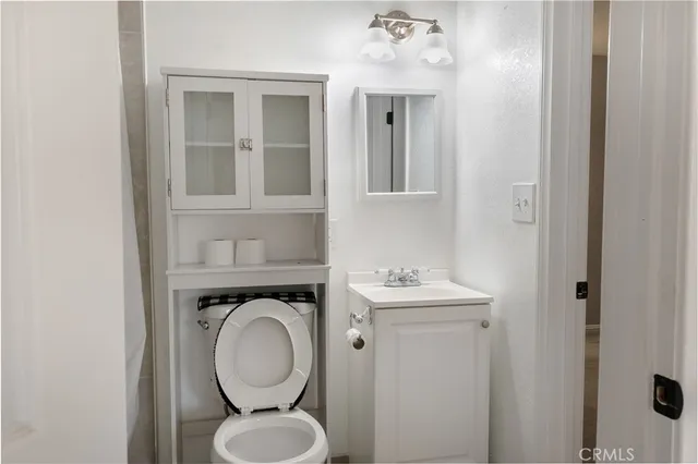 a bathroom with a toilet and a sink