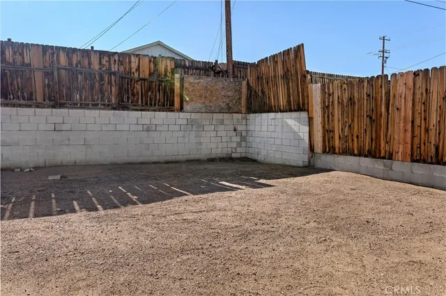 a view of a backyard of the house