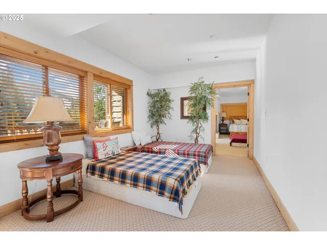 a bedroom with a bed and a table in it