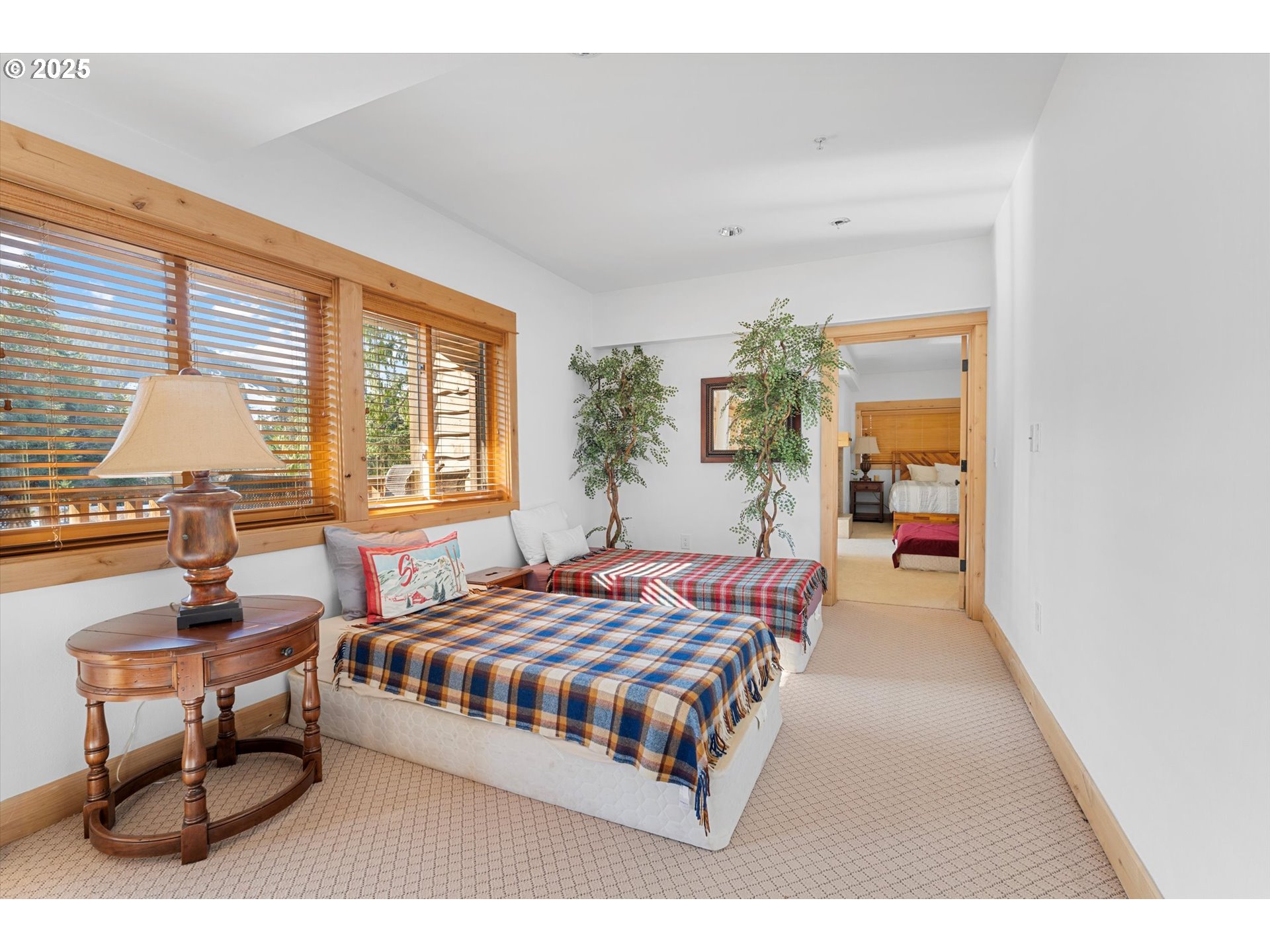 31200 East Collins Lake Road, Unit 1 Government Camp, OR 97028 - Photo 14 of 38 a bedroom with a bed and a table in it