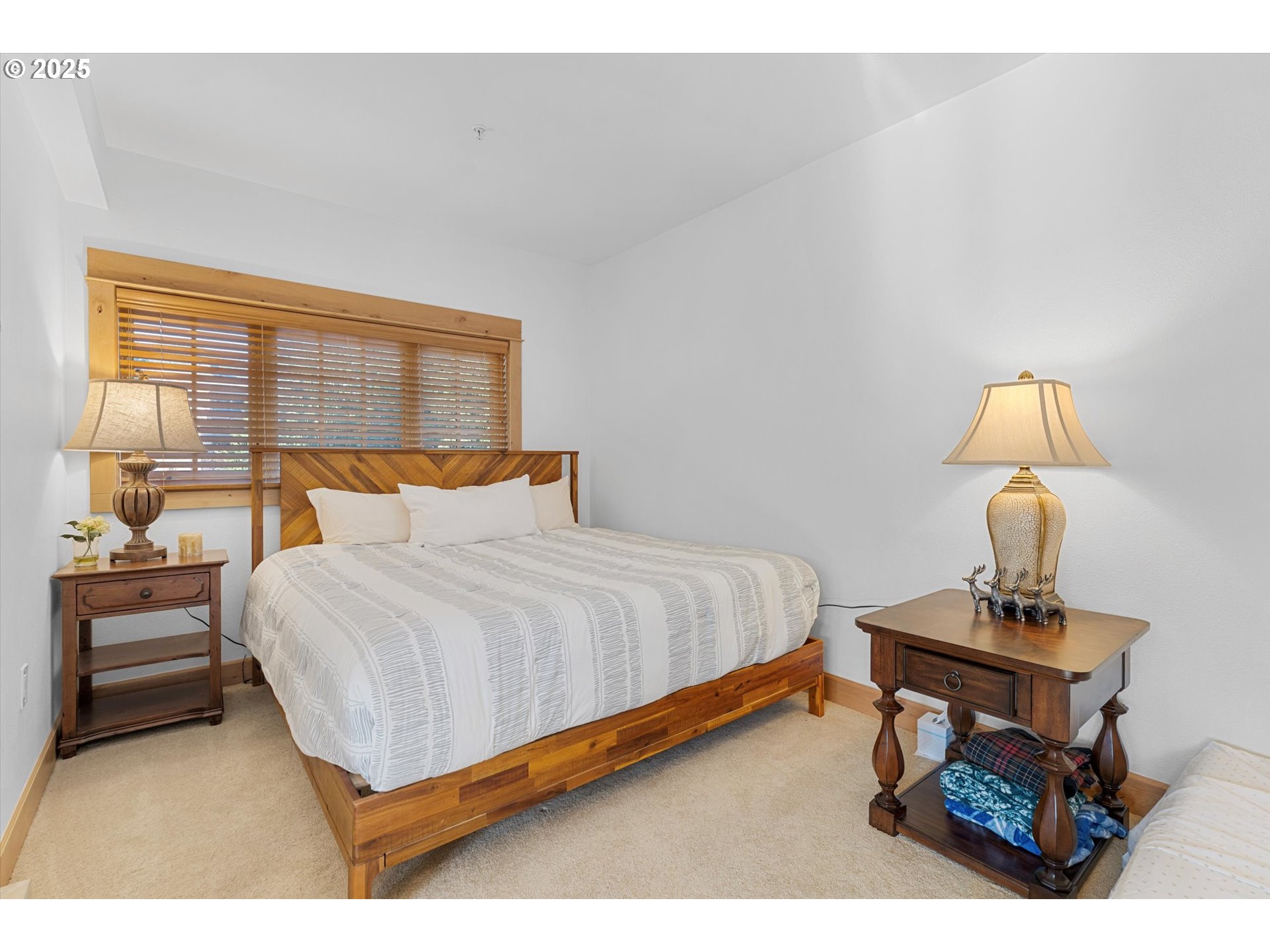 31200 East Collins Lake Road, Unit 1 Government Camp, OR 97028 - Photo 15 of 38 a bedroom with a bed and a table in it