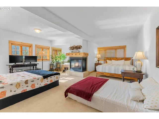 a bedroom with bed and window