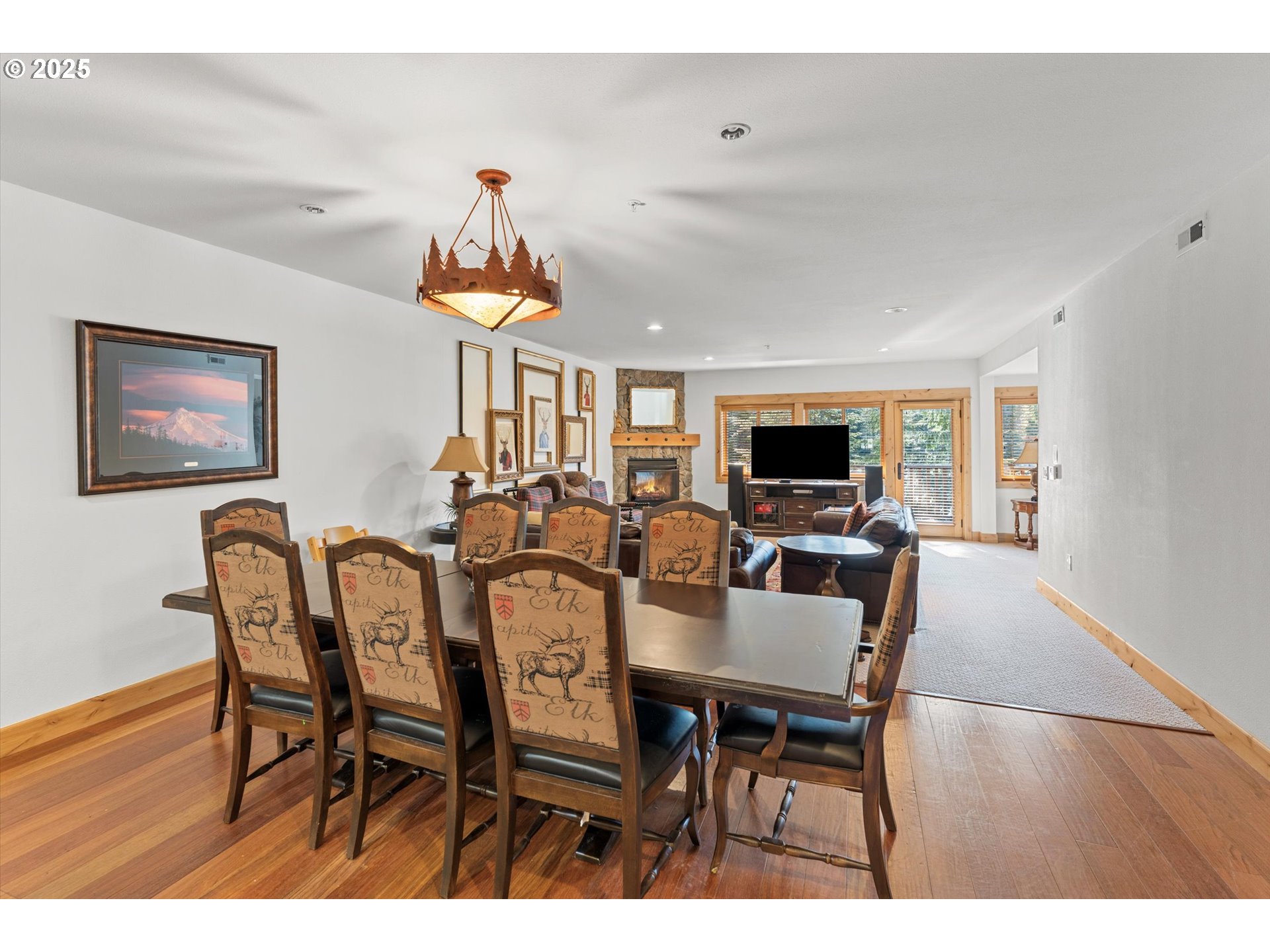 31200 East Collins Lake Road, Unit 1 Government Camp, OR 97028 - Photo 5 of 38 a view of a dining room with furniture window and wooden floor
