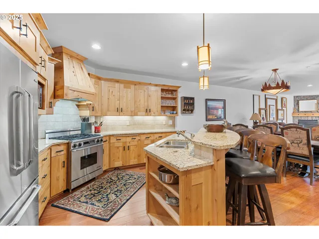 a kitchen with a sink stove and refrigerator