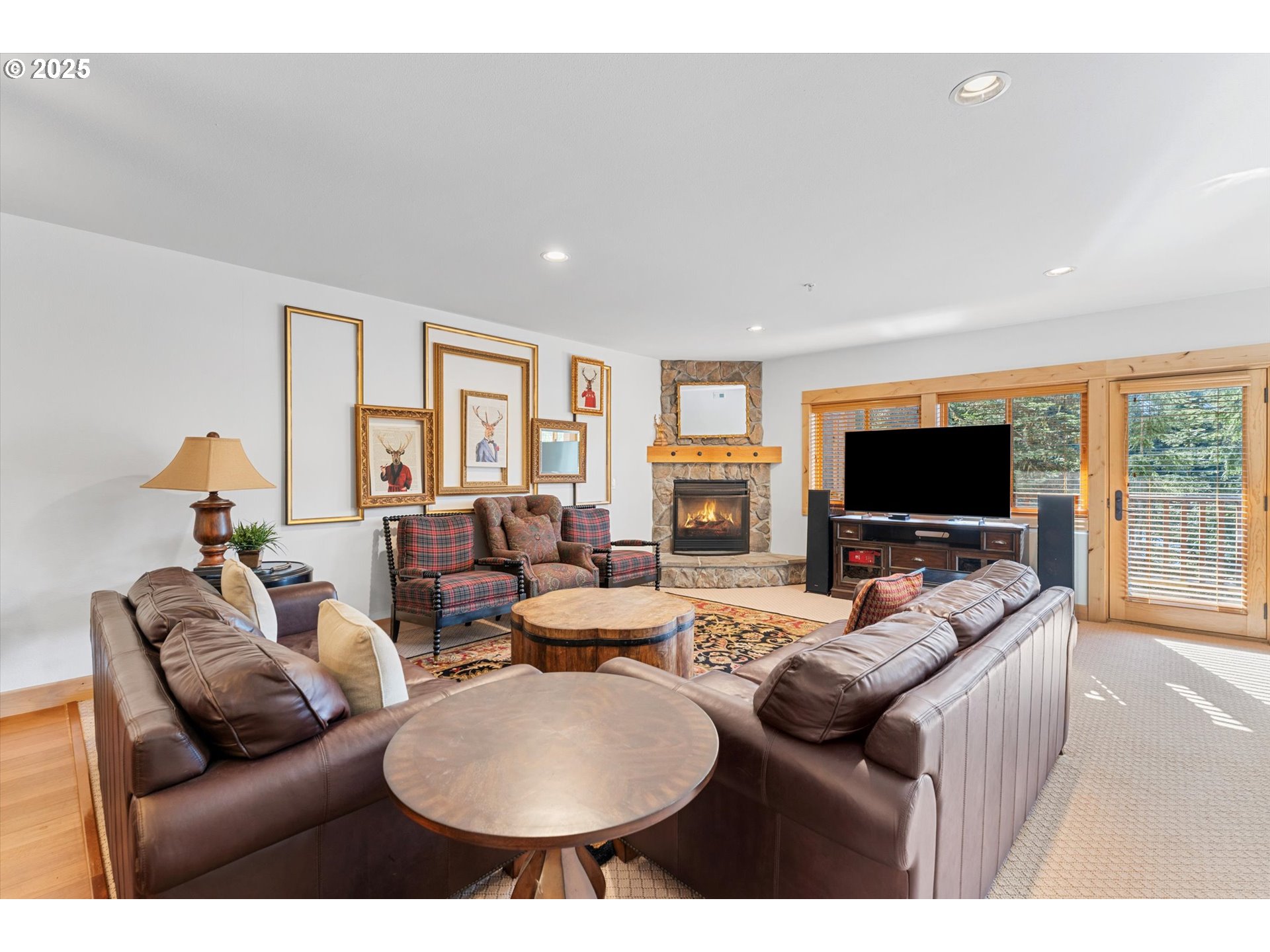 31200 East Collins Lake Road, Unit 1 Government Camp, OR 97028 - Photo 9 of 38 a living room with furniture and a flat screen tv