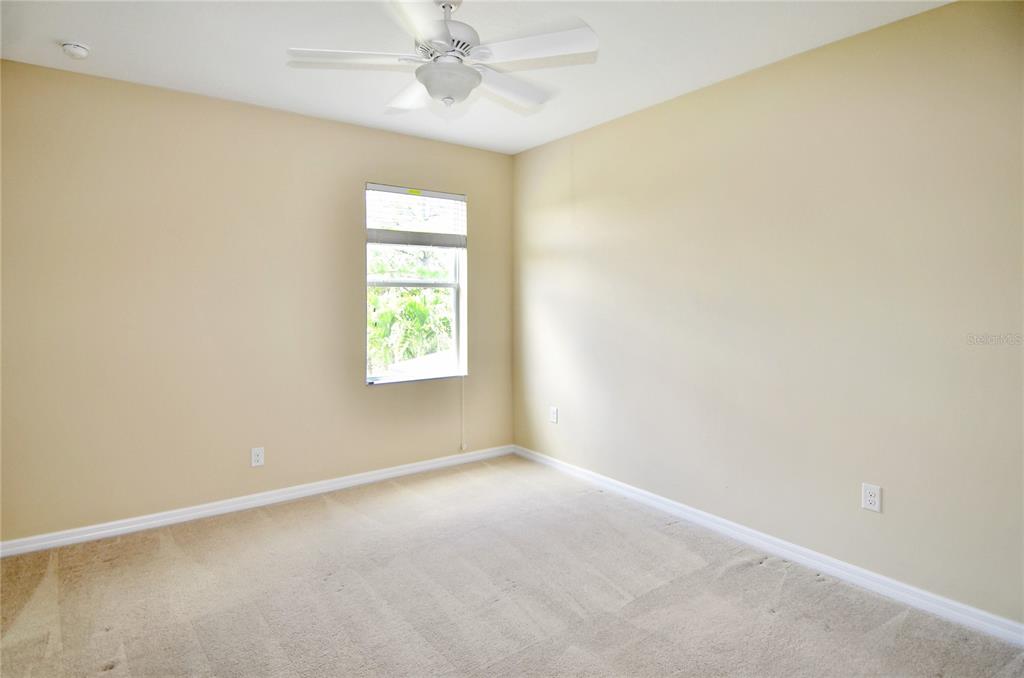 205 Cohosh Road Nokomis, FL 34275 - Photo 13 of 79 an empty room with a window and a fan