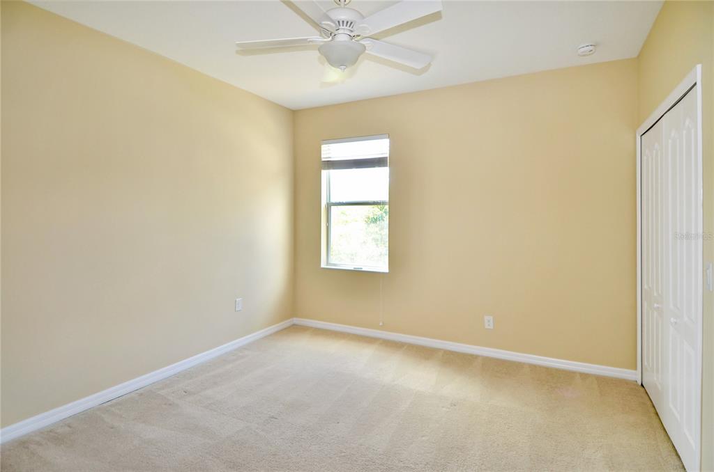 205 Cohosh Road Nokomis, FL 34275 - Photo 14 of 79 an empty room with a window and a fan
