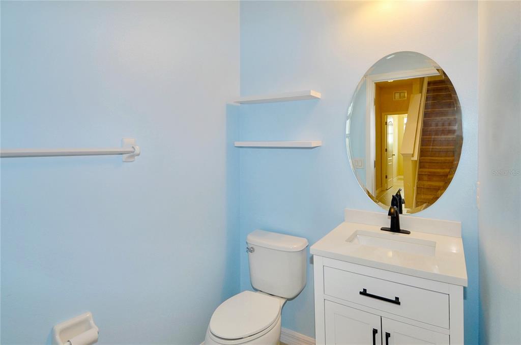 205 Cohosh Road Nokomis, FL 34275 - Photo 29 of 79 a bathroom with a sink mirror and toilet