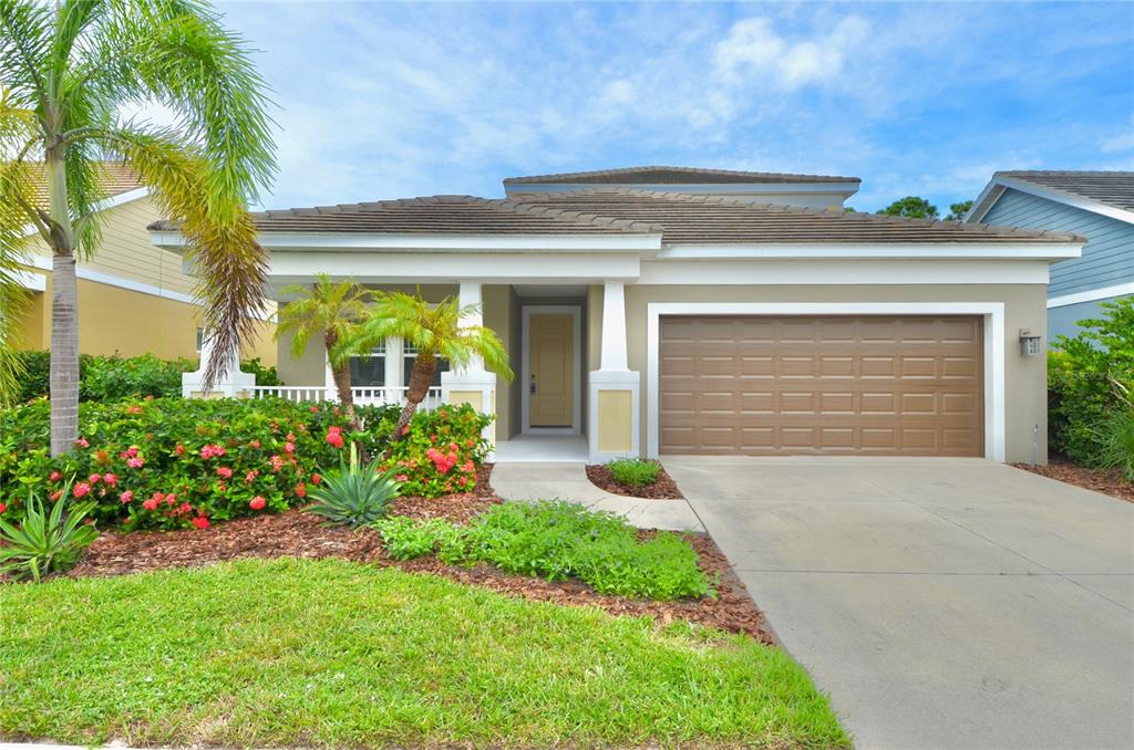 205 Cohosh Road Nokomis, FL 34275 - Photo 35 of 79 a front view of house and yard with green space