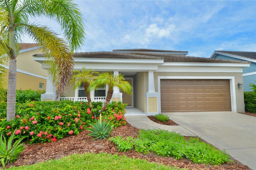 205 Cohosh Road Nokomis, FL 34275 - Photo 50 of 79 a front view of house and yard with green space