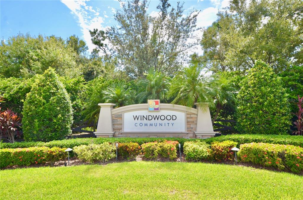 205 Cohosh Road Nokomis, FL 34275 - Photo 58 of 79 a sign of golf club on a wall under a tree