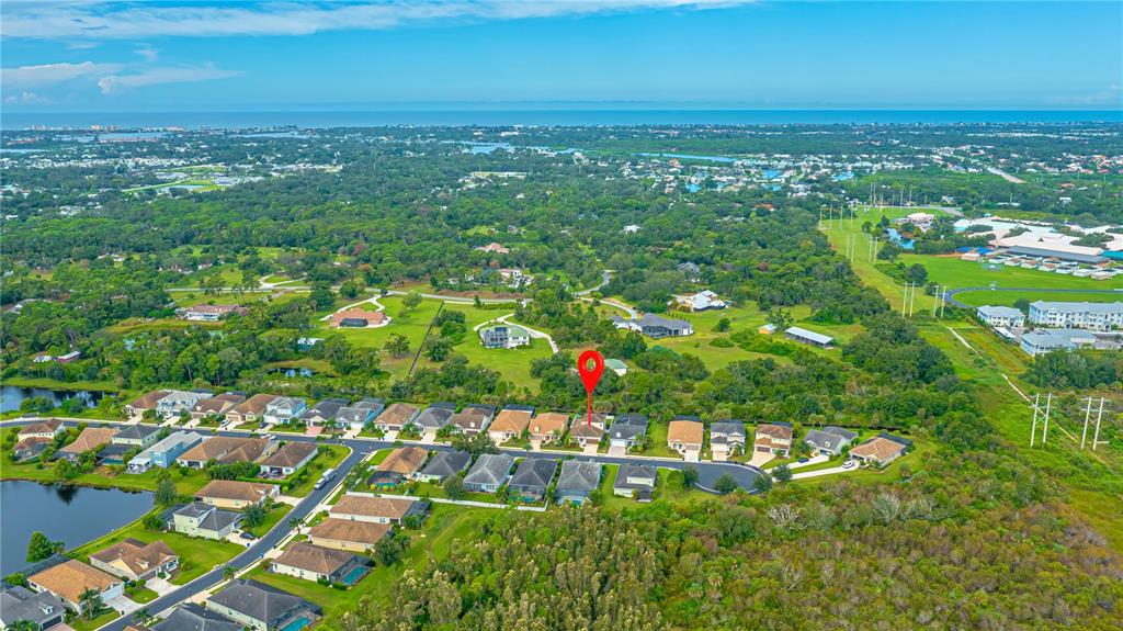 205 Cohosh Road Nokomis, FL 34275 - Photo 74 of 79 an aerial view of residential houses with outdoor space and trees