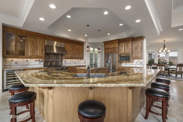 a kitchen with counter top space and stainless steel appliances