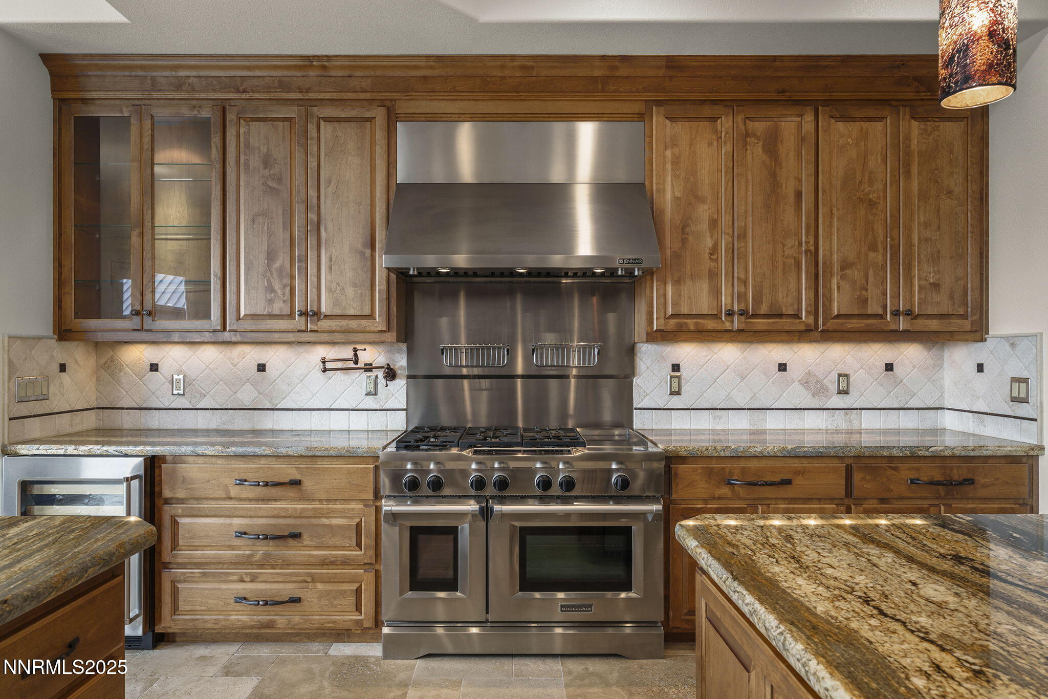 345 James Canyon Loop Genoa, NV 89411 - Photo 16 of 54 a kitchen with granite countertop a stove and a cabinets