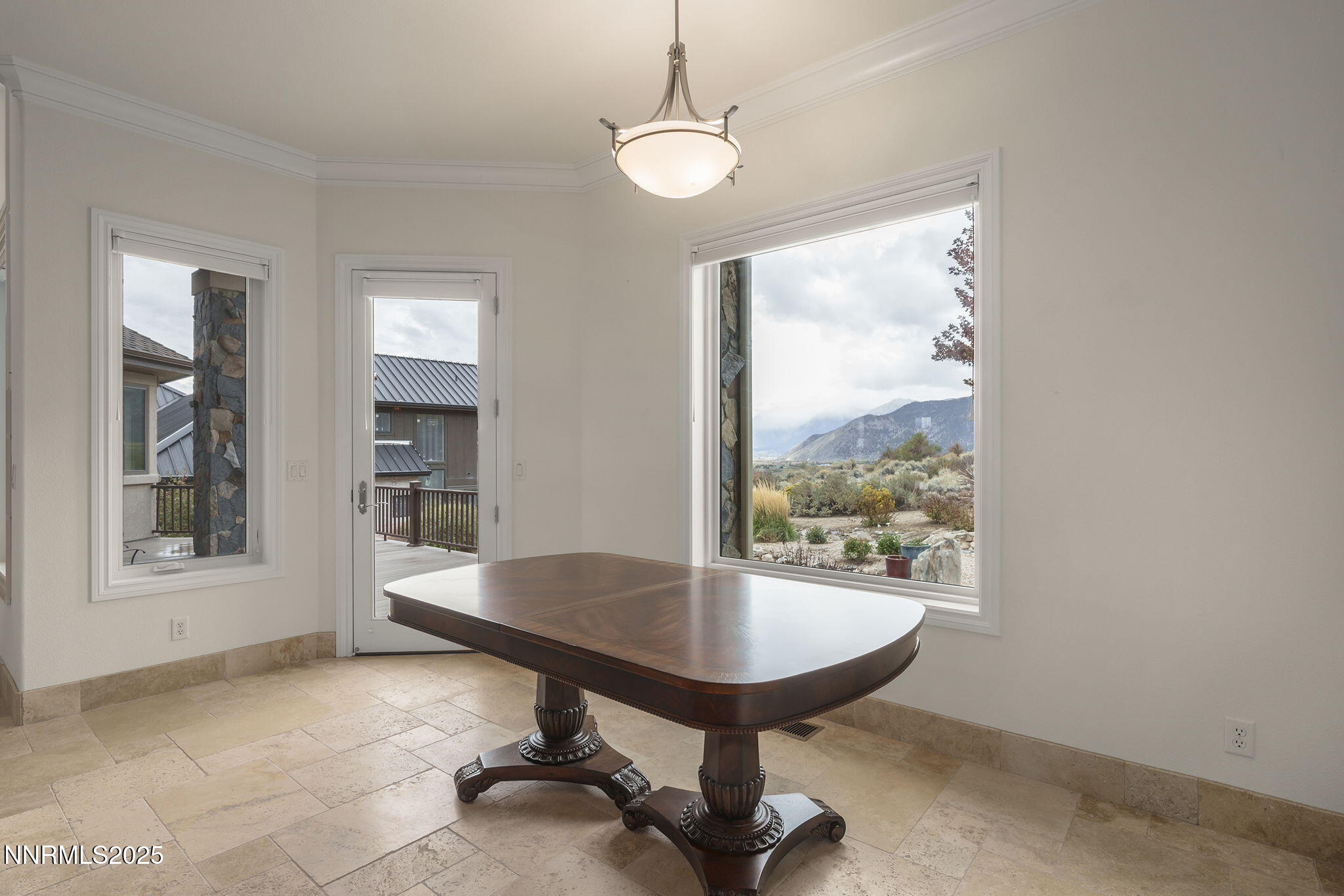 345 James Canyon Loop Genoa, NV 89411 - Photo 17 of 54 a view of a room with a table and chairs