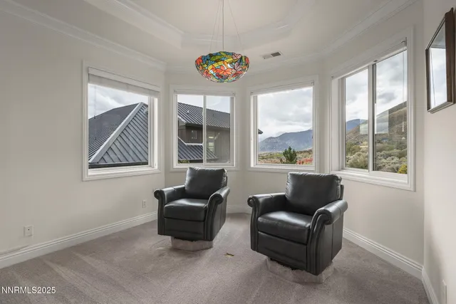 a bathroom with a granite countertop tub and a large window