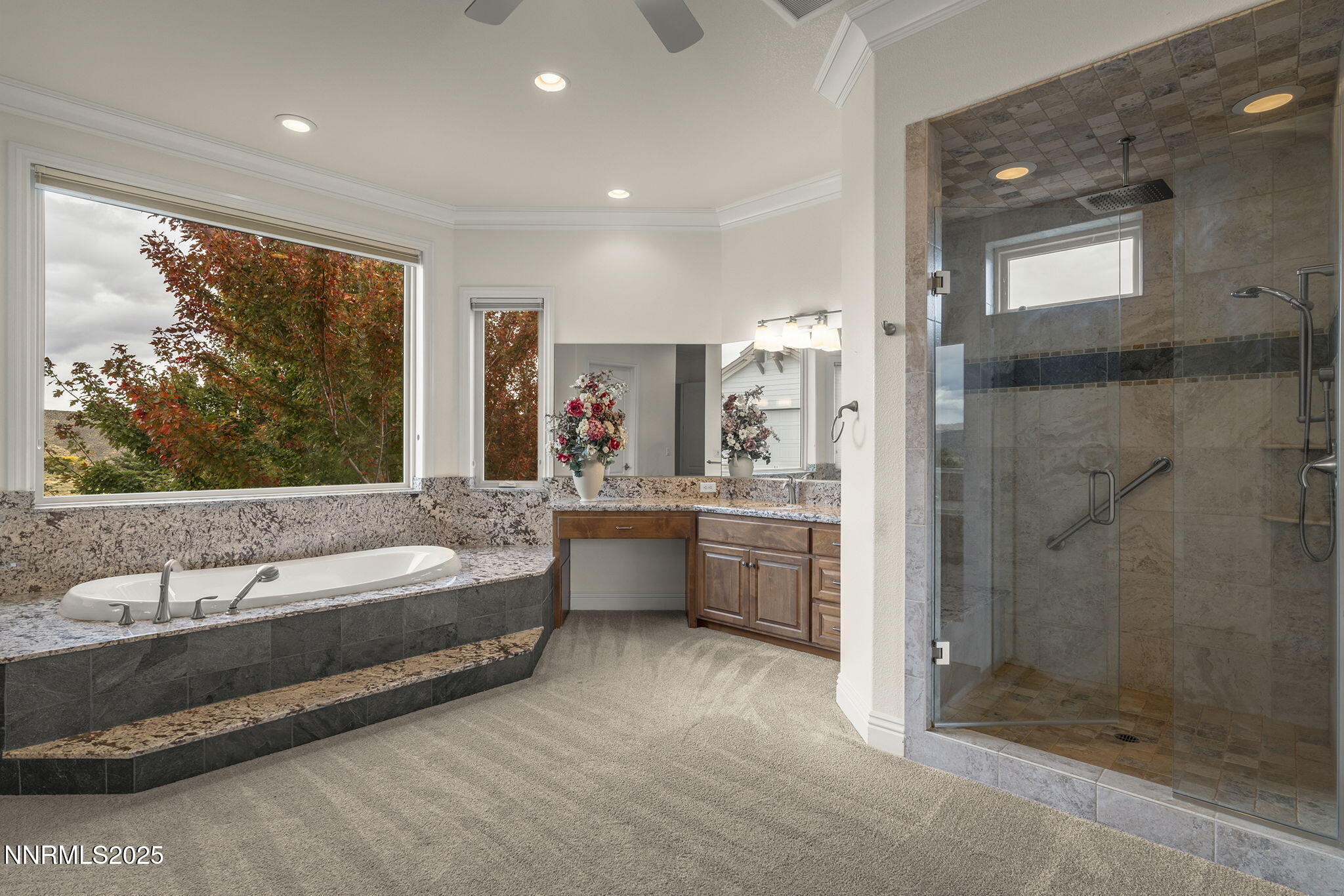 345 James Canyon Loop Genoa, NV 89411 - Photo 23 of 54 a spacious bathroom with a double vanity sink a mirror and a bathtub