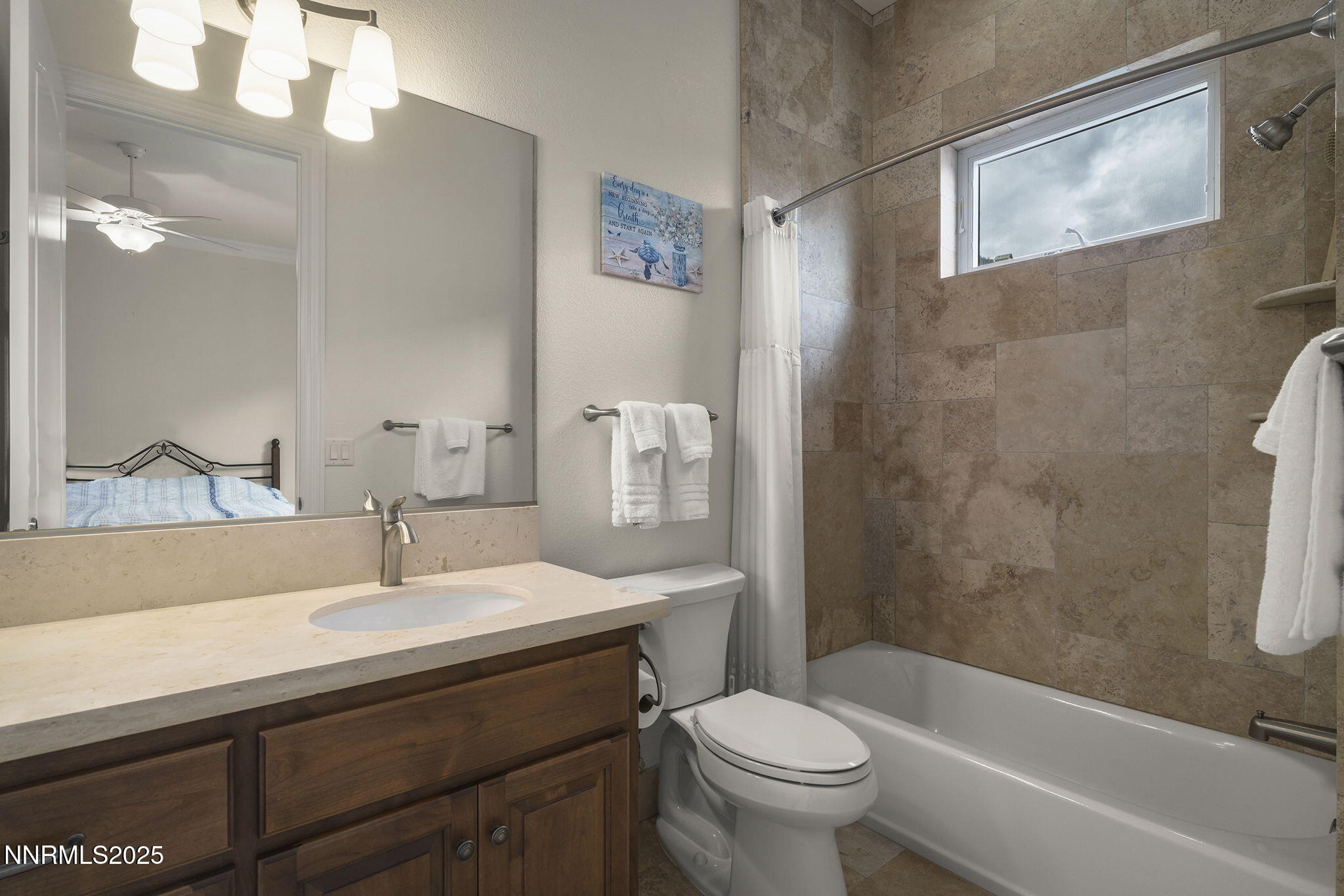 345 James Canyon Loop Genoa, NV 89411 - Photo 29 of 54 a bathroom with a sink a toilet and shower