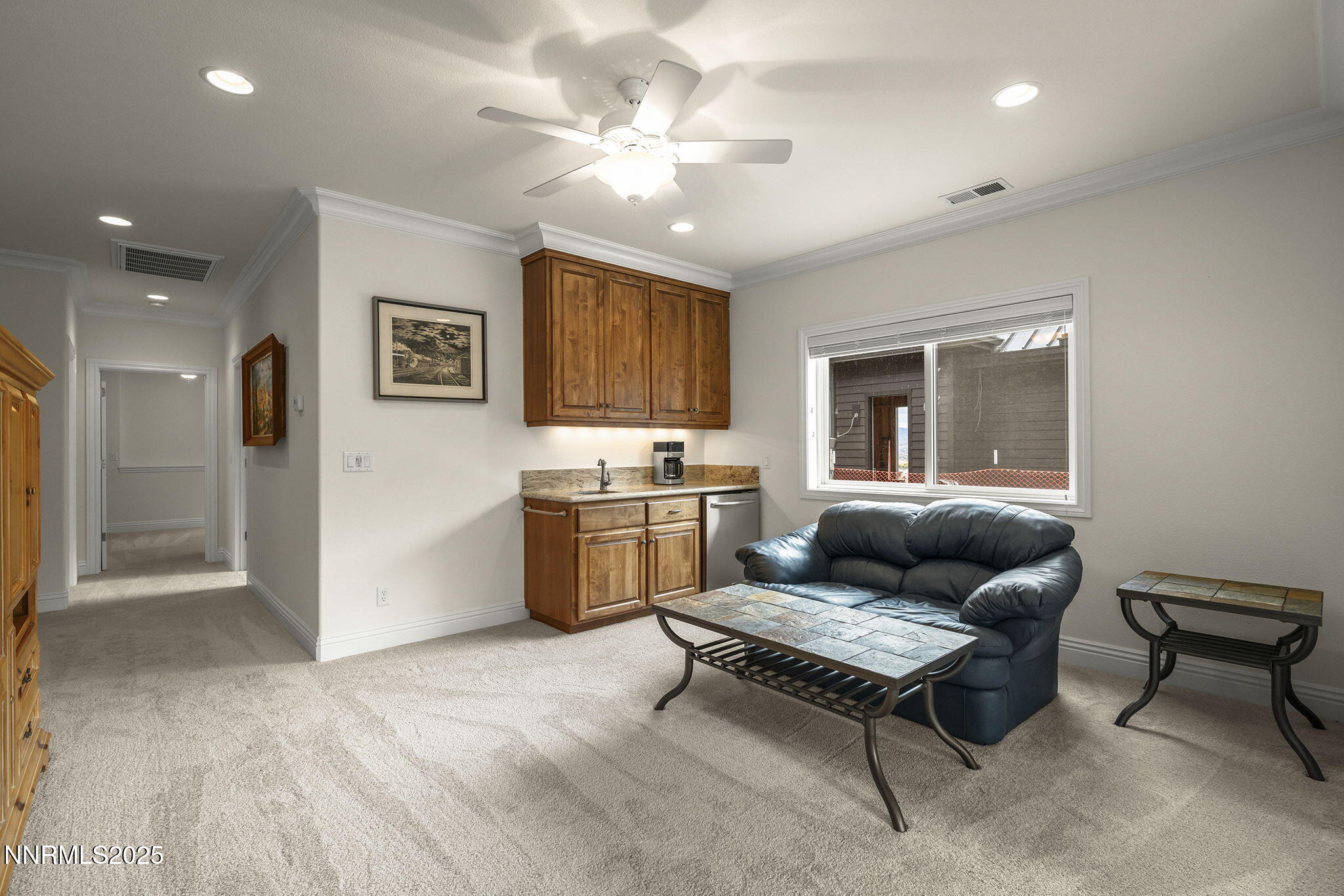 345 James Canyon Loop Genoa, NV 89411 - Photo 33 of 54 a living room with furniture and a chandelier