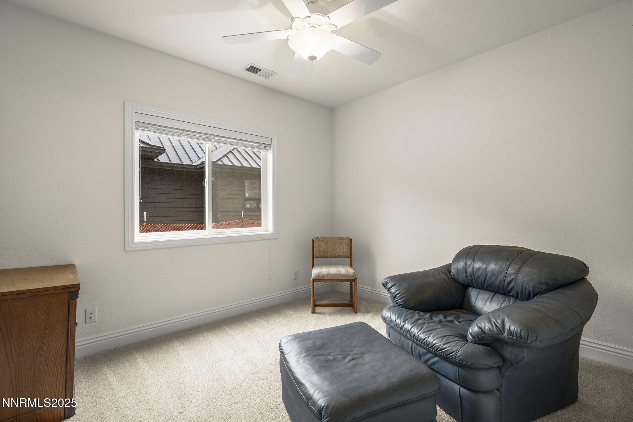 345 James Canyon Loop Genoa, NV 89411 - Photo 34 of 54 a living room with furniture and a window