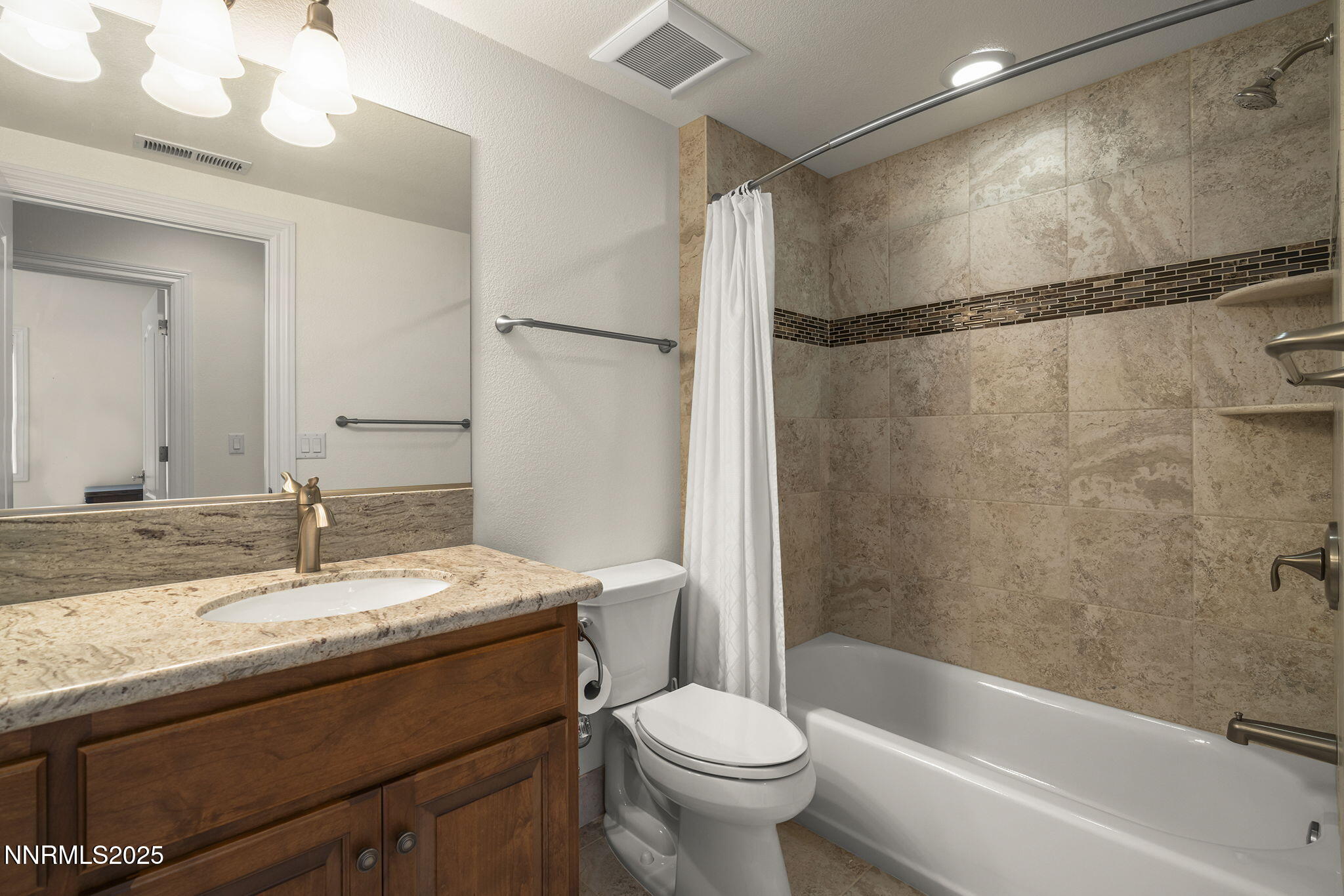 345 James Canyon Loop Genoa, NV 89411 - Photo 36 of 54 a bathroom with a sink and a mirror