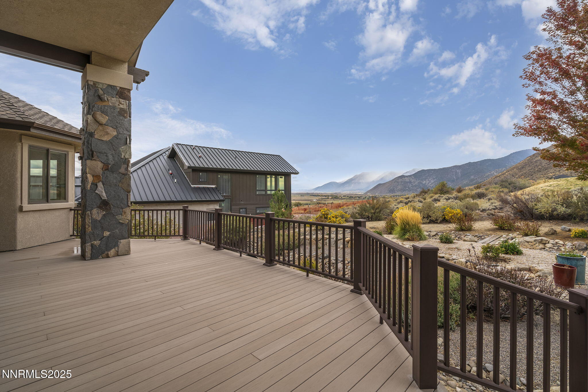 345 James Canyon Loop Genoa, NV 89411 - Photo 37 of 54 a view of a balcony with wooden floor and city view