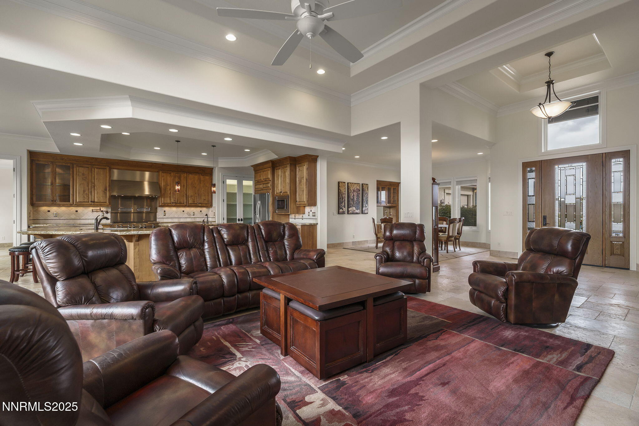 345 James Canyon Loop Genoa, NV 89411 - Photo 10 of 54 a living room with furniture kitchen view and a chandelier