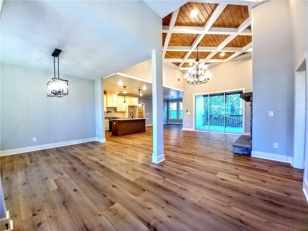 136 Rainey Road Temple, GA 30179 - Photo 18 of 78 a view of empty room with wooden floor and fan
