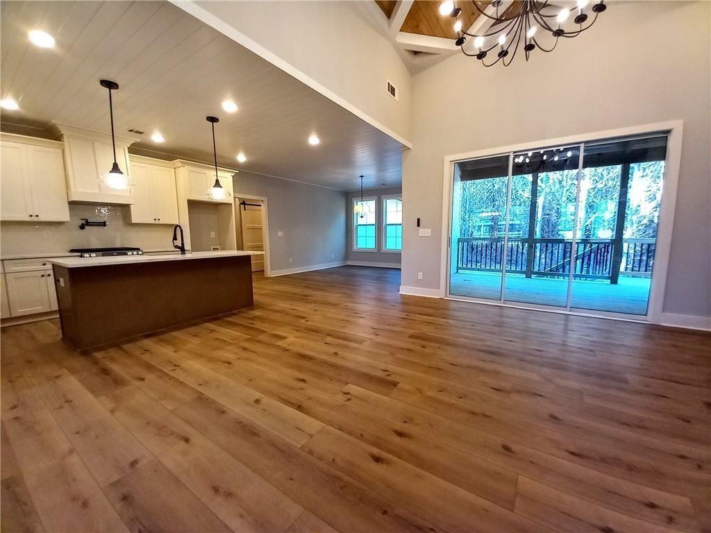 136 Rainey Road Temple, GA 30179 - Photo 30 of 78 a view of kitchen with granite countertop cabinets and wooden floor