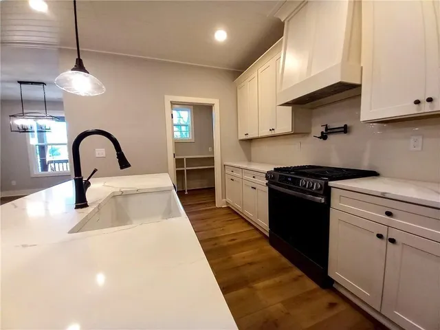 a view of a big room with a ceiling fan