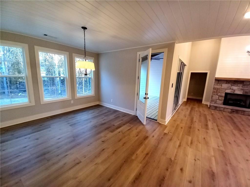 136 Rainey Road Temple, GA 30179 - Photo 37 of 78 a view of a room with wooden floor fireplace and windows