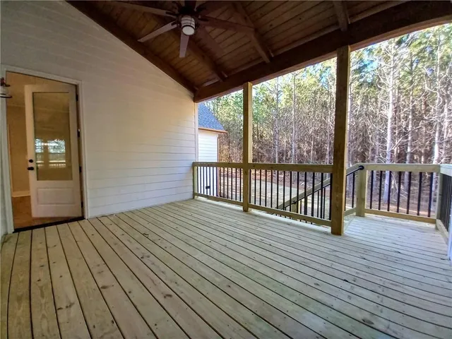 a spacious bathroom with a double vanity sink a mirror and a shower