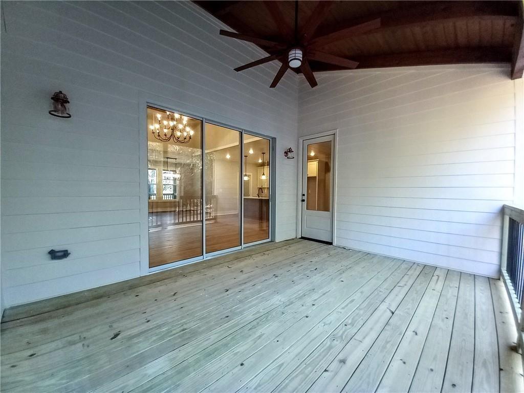 136 Rainey Road Temple, GA 30179 - Photo 40 of 78 a view of empty room with wooden floor and fan