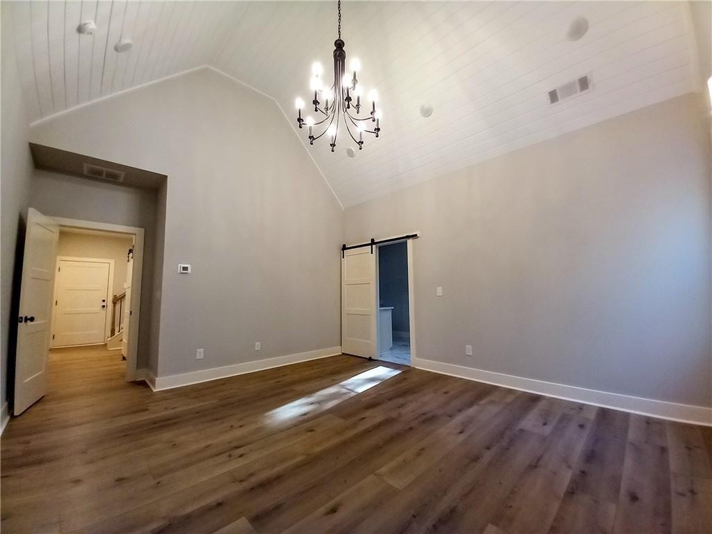 136 Rainey Road Temple, GA 30179 - Photo 44 of 78 a view of an empty room with wooden floor