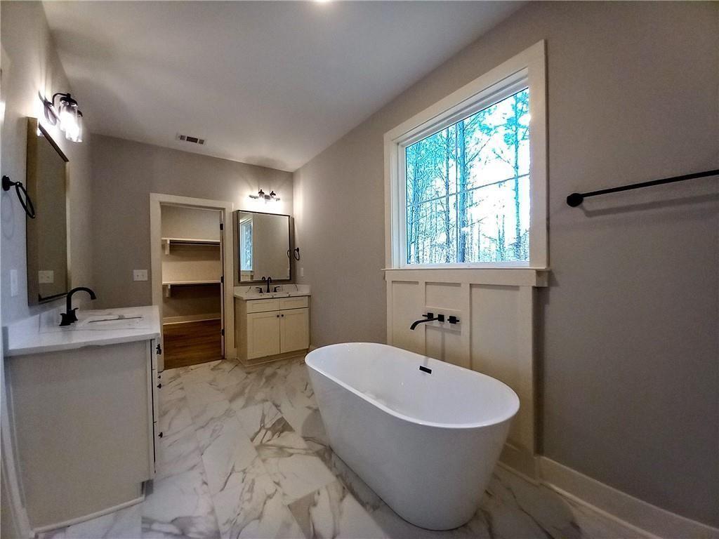136 Rainey Road Temple, GA 30179 - Photo 47 of 78 a bathroom with a sink toilet tub and mirror