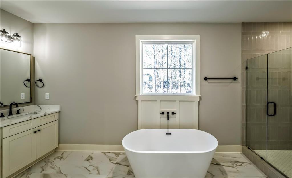 136 Rainey Road Temple, GA 30179 - Photo 48 of 78 a bathroom with a sink a toilet and shower