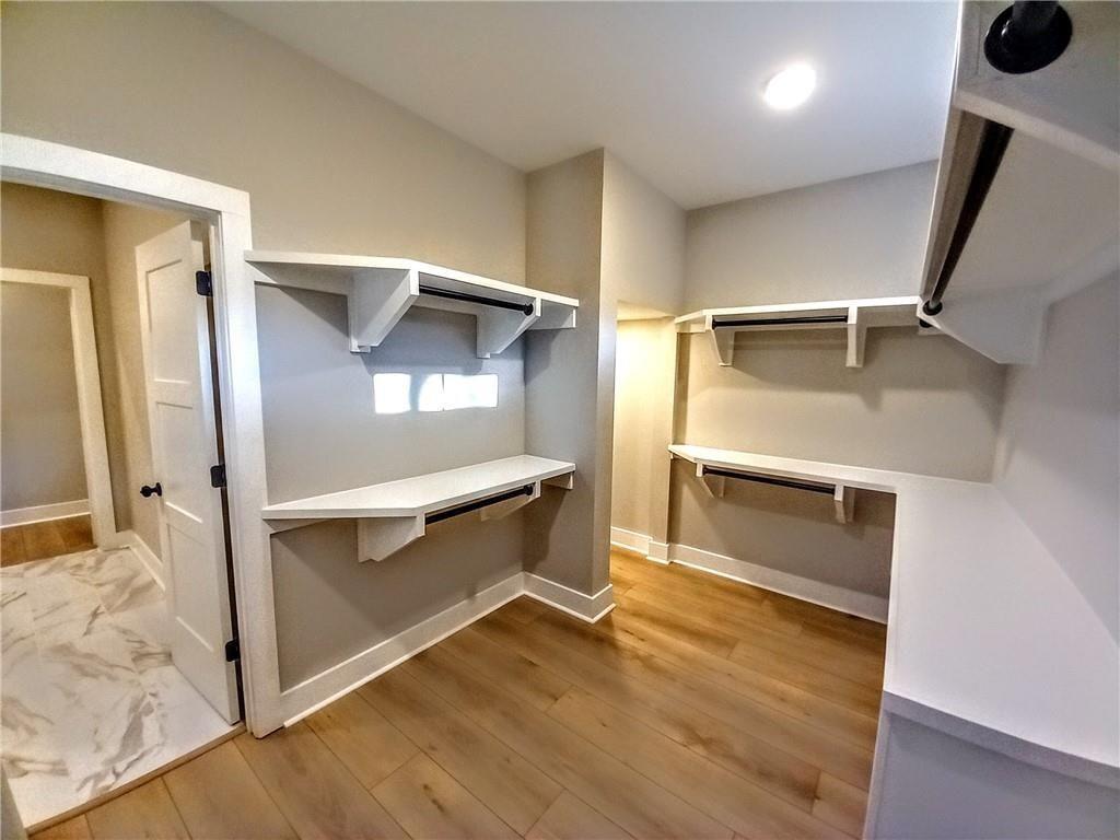 136 Rainey Road Temple, GA 30179 - Photo 50 of 78 a view of an empty room with wooden floor and a window