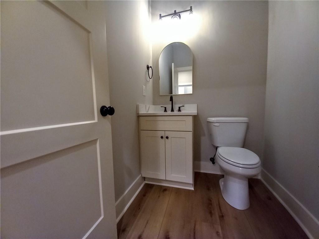 136 Rainey Road Temple, GA 30179 - Photo 55 of 78 a bathroom with a toilet a sink and mirror