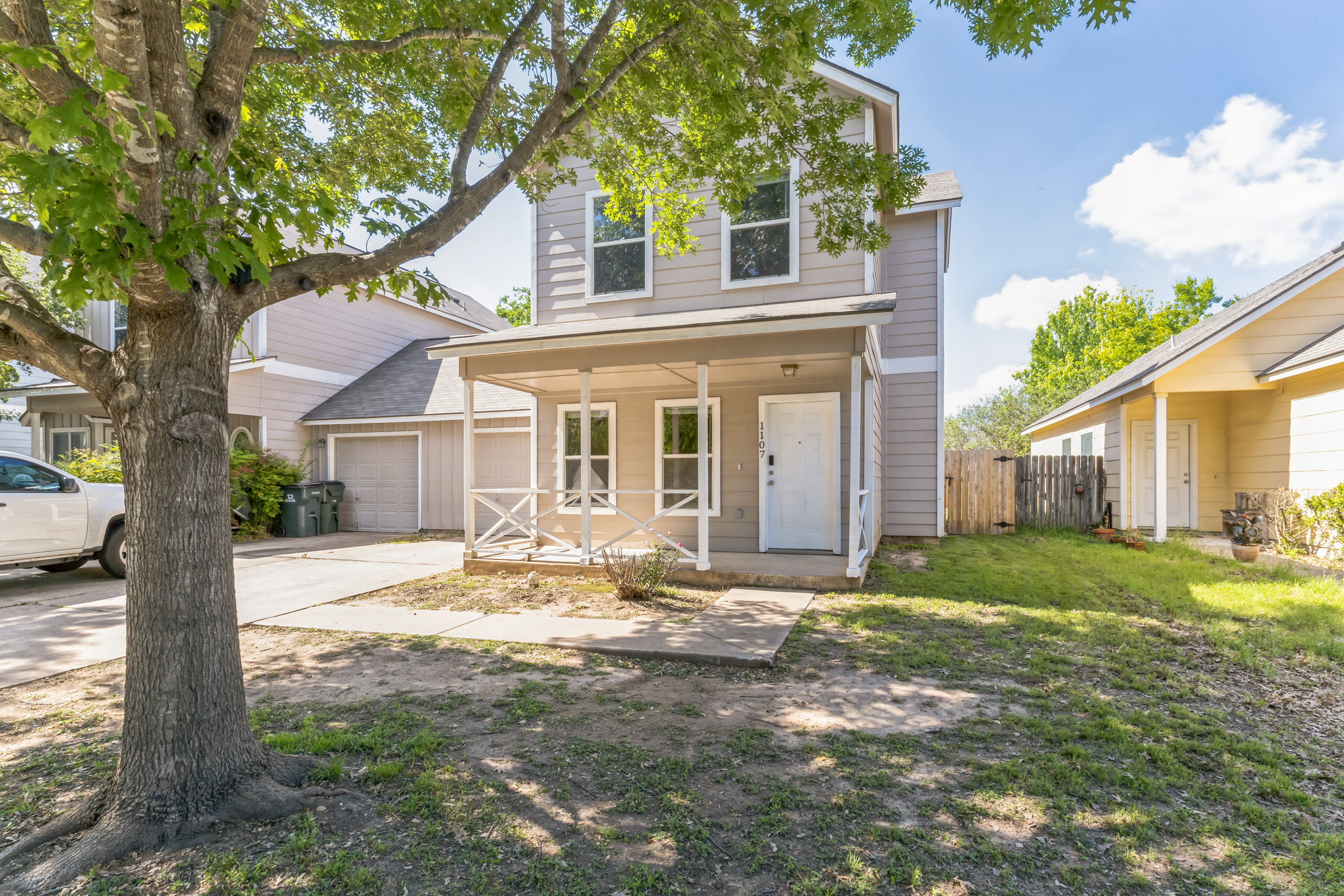 1107 East 3rd Street Georgetown, TX 78626 - Photo 1 of 36 View of front facade featuring a porch, a shingled roof, and concrete driveway