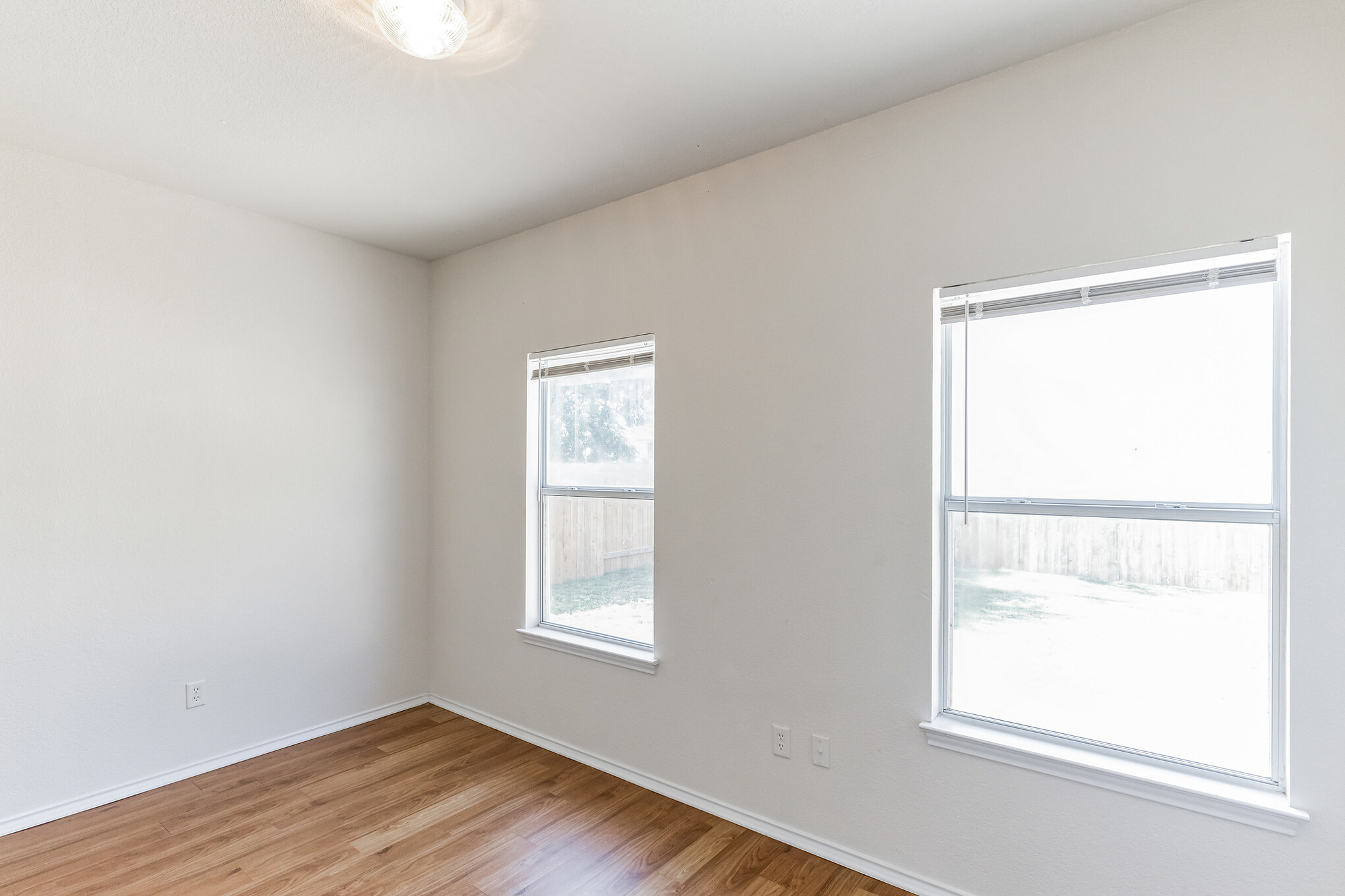 1107 East 3rd Street Georgetown, TX 78626 - Photo 14 of 36 Empty room featuring light wood-type flooring and baseboards
