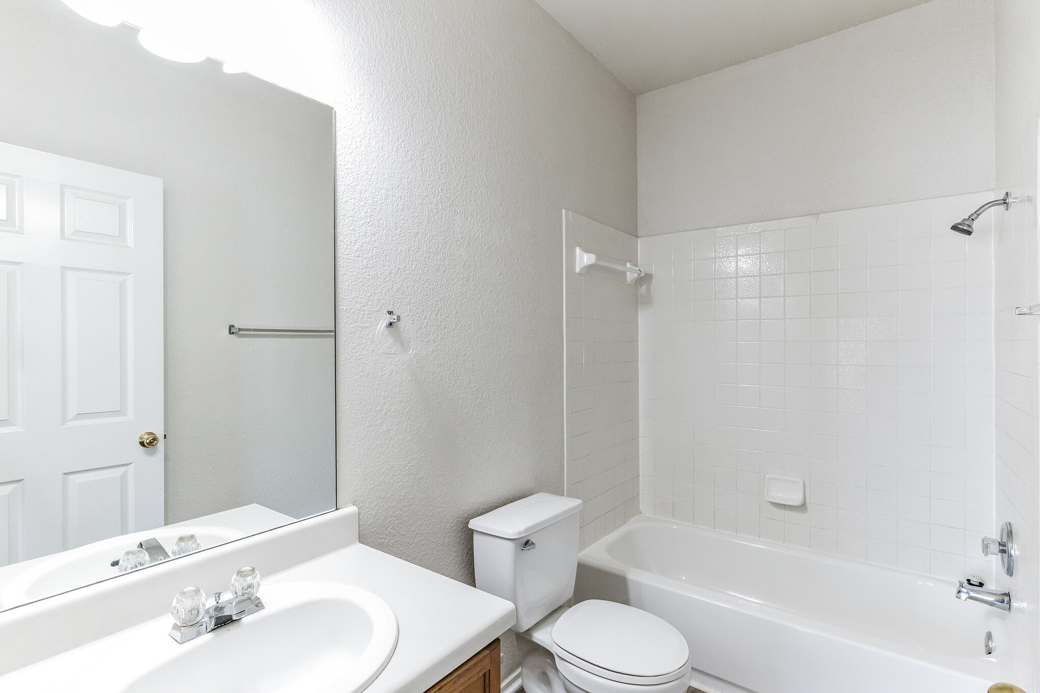 1107 East 3rd Street Georgetown, TX 78626 - Photo 17 of 36 Full bathroom with vanity, bathtub / shower combination, and a textured wall