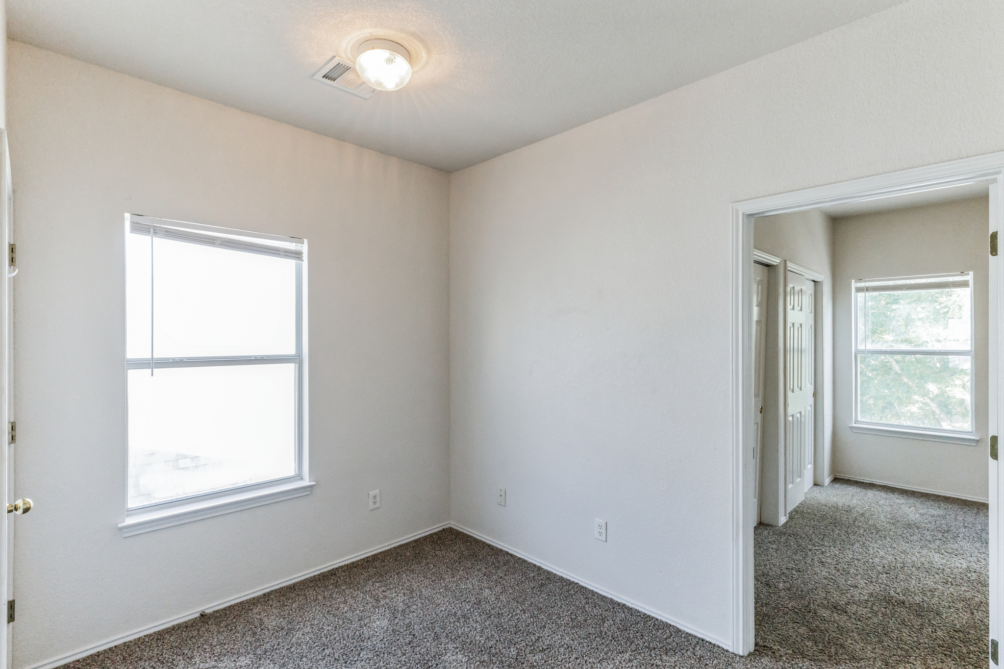 1107 East 3rd Street Georgetown, TX 78626 - Photo 18 of 36 Empty room featuring dark carpet