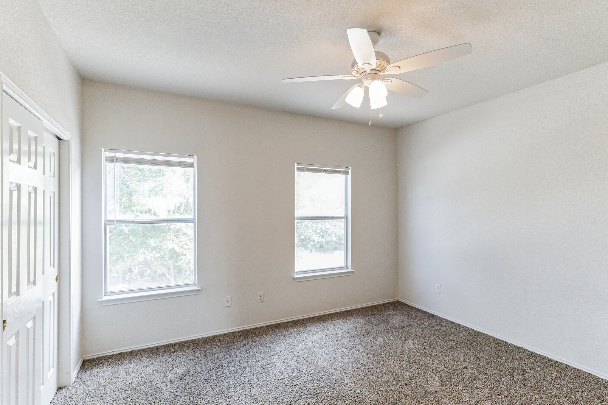 1107 East 3rd Street Georgetown, TX 78626 - Photo 20 of 36 Carpeted empty room with ceiling fan and baseboards