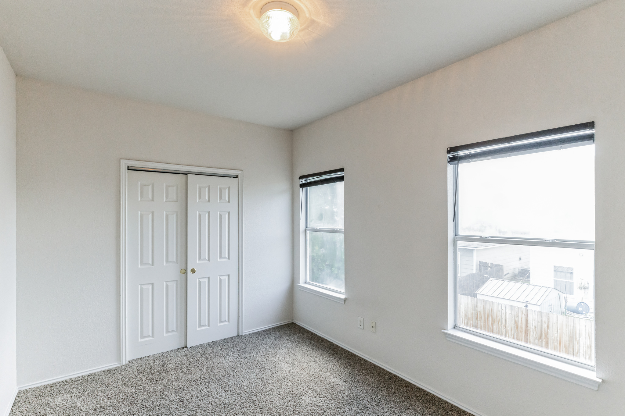 1107 East 3rd Street Georgetown, TX 78626 - Photo 24 of 36 Unfurnished bedroom featuring carpet flooring and a closet