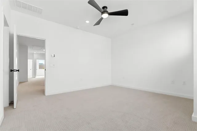 a bathroom with double vanity sinks and a mirror