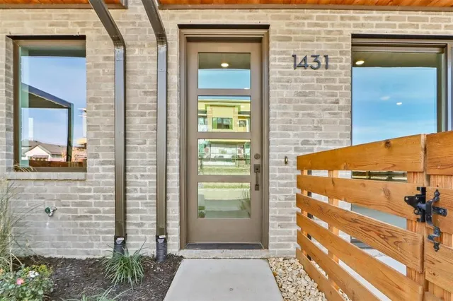 a view of a door and a window
